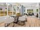 Open-concept dining room with a view of the living room with large windows for plenty of natural light at 2032 Spink Nw St, Atlanta, GA 30318