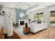 Bright living room features a fireplace, modern furnishings, and an open layout with ample natural light at 2032 Spink Nw St, Atlanta, GA 30318