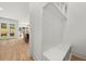Convenient mudroom with built-in bench and storage, adjacent to dining area and backyard access at 2032 Spink Nw St, Atlanta, GA 30318