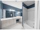 Elegant bathroom with a white vanity, dual sinks, a large mirror, and a separate tub/shower area at 3334 Peachtree Ne Rd # 608, Atlanta, GA 30326