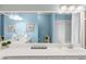 Bright bathroom featuring double vanity, framed mirror, coastal decor, and a combined tub and shower at 3334 Peachtree Ne Rd # 608, Atlanta, GA 30326
