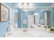 Elegant bathroom featuring dual sinks, large mirror, art, and a separate tub/shower area at 3334 Peachtree Ne Rd # 608, Atlanta, GA 30326