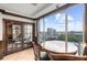 Bright breakfast nook boasts city views and a charming wood dining table at 3334 Peachtree Ne Rd # 608, Atlanta, GA 30326