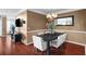 Open-concept dining room with hardwood floors and modern lighting at 3334 Peachtree Ne Rd # 608, Atlanta, GA 30326