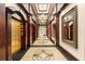 Beautifully designed hallway with decorative floors, mirrors, and convenient elevator access at 3334 Peachtree Ne Rd # 608, Atlanta, GA 30326