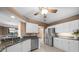 Bright kitchen features stainless steel appliances, granite countertops, and white cabinets at 3334 Peachtree Ne Rd # 608, Atlanta, GA 30326