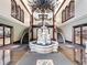 Ornate lobby with fountain, marble floors, dual staircases, and chandelier at 3334 Peachtree Ne Rd # 608, Atlanta, GA 30326