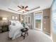 Cozy main bedroom boasts a tray ceiling and a private balcony at 3334 Peachtree Ne Rd # 608, Atlanta, GA 30326