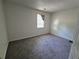 Cozy carpeted bedroom features a window providing natural light at 3832 Natalie Way, Ellenwood, GA 30294