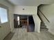 Bright entryway featuring neutral tile flooring and a staircase leading to the upper level at 3832 Natalie Way, Ellenwood, GA 30294