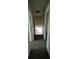 Upstairs hallway with carpet and several doors to bedrooms and the bathroom at 3832 Natalie Way, Ellenwood, GA 30294