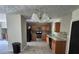 Charming kitchen features wooden cabinets, granite countertops, and tiled backsplash, ideal for cooking at 3832 Natalie Way, Ellenwood, GA 30294