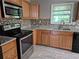 Well-appointed kitchen with granite countertops, tile backsplash, and modern stainless steel appliances at 3832 Natalie Way, Ellenwood, GA 30294