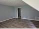 Living room with neutral paint, wood-look floors, and ample natural light; perfect space for relaxation at 3832 Natalie Way, Ellenwood, GA 30294