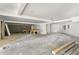 Spacious basement with concrete flooring, offering ample potential for customization and versatile use at 1176 Lullwater Ne Rd, Atlanta, GA 30307