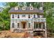 New construction featuring a brick and hardie board exterior with dormers and a covered front entry at 1176 Lullwater Ne Rd, Atlanta, GA 30307