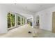 Bright, open living area with large windows and graceful archways at 1176 Lullwater Ne Rd, Atlanta, GA 30307