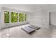 Light-filled room featuring wainscoting, and large windows offering nature views at 1176 Lullwater Ne Rd, Atlanta, GA 30307