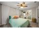 Bedroom featuring soft lighting, cozy seating, and ensuite bathroom at 268 Cottonwood Creek Cir, Canton, GA 30114