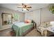 Bedroom featuring a plush bed, large windows, and tranquil decor for a relaxing atmosphere at 268 Cottonwood Creek Cir, Canton, GA 30114