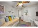 Bedroom showcases a ceiling fan, colorful accents, natural light, and ample space at 268 Cottonwood Creek Cir, Canton, GA 30114