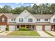 Charming townhome with a well-manicured lawn and colorful landscaping adding to its curb appeal at 268 Cottonwood Creek Cir, Canton, GA 30114