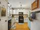 Well-equipped kitchen with granite countertops, modern appliances, and ample cabinet space for storage at 268 Cottonwood Creek Cir, Canton, GA 30114