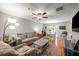 Bright and airy living room with hardwood floors, a ceiling fan, and a cozy seating area at 268 Cottonwood Creek Cir, Canton, GA 30114