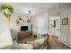 Cozy loft area with comfortable seating, decorative shelving, and natural light at 268 Cottonwood Creek Cir, Canton, GA 30114