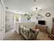 Bright and airy loft featuring neutral tones, hanging plants, and comfortable furnishings at 268 Cottonwood Creek Cir, Canton, GA 30114
