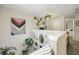 Bright loft area featuring unique decorations, hanging plants, and ample natural light at 268 Cottonwood Creek Cir, Canton, GA 30114