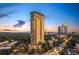 Stunning aerial view of the high-rise building with city skyline and lush greenery at 2881 Peachtree Ne Rd # 2304, Atlanta, GA 30305