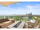Inviting balcony with a modern fire pit and seating area, offering stunning views of the city skyline at 2881 Peachtree Ne Rd # 2304, Atlanta, GA 30305
