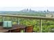 Relaxing view from the balcony overlooking lush greenery and the Atlanta city skyline at 2881 Peachtree Ne Rd # 2304, Atlanta, GA 30305