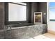 Luxurious bathroom featuring a tiled shower and a soaking tub for a spa-like experience at home at 2881 Peachtree Ne Rd # 2304, Atlanta, GA 30305