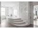 Bright bathroom featuring a mosaic bathtub with steps and sleek fixtures at 2881 Peachtree Ne Rd # 2304, Atlanta, GA 30305