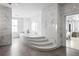 Modern bathroom features a mosaic bathtub with steps, marble walls, and natural light at 2881 Peachtree Ne Rd # 2304, Atlanta, GA 30305