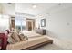 Bright, airy bedroom with a balcony, light carpet, and a sleek, modern aesthetic at 2881 Peachtree Ne Rd # 2304, Atlanta, GA 30305