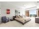Spacious bedroom with a private balcony, plush carpeting, and contemporary furnishings at 2881 Peachtree Ne Rd # 2304, Atlanta, GA 30305