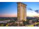 Luxury high-rise condo building featuring multi-level balconies and stunning city views at 2881 Peachtree Ne Rd # 2304, Atlanta, GA 30305