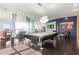 Spacious game room featuring a stylish pool table, modern lighting, and unique design elements at 2881 Peachtree Ne Rd # 2304, Atlanta, GA 30305