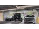 Modern garage featuring a collection of luxury cars under bright lighting at 2881 Peachtree Ne Rd # 2304, Atlanta, GA 30305