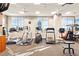 Well-equipped fitness center with cardio machines and large windows at 2881 Peachtree Ne Rd # 2304, Atlanta, GA 30305