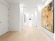 Neutral hallway with white walls, stone flooring, recessed lights and large abstract artwork at 2881 Peachtree Ne Rd # 2304, Atlanta, GA 30305