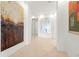 Bright hallway showcasing art with neutral walls, tile floor, and access to bedrooms and living areas at 2881 Peachtree Ne Rd # 2304, Atlanta, GA 30305