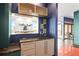 Kitchen features a wet bar, stainless steel sink and faucet, ample counter space, and view to the dining area at 2881 Peachtree Ne Rd # 2304, Atlanta, GA 30305