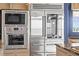 Stainless steel Wolf oven and microwave alongside the Sub-Zero refrigerator in this updated kitchen at 2881 Peachtree Ne Rd # 2304, Atlanta, GA 30305