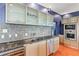Gourmet kitchen featuring granite countertops, stainless steel appliances, and custom cabinetry at 2881 Peachtree Ne Rd # 2304, Atlanta, GA 30305
