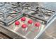 A stainless steel Wolf cooktop with six burners and red knobs sits atop the kitchen island at 2881 Peachtree Ne Rd # 2304, Atlanta, GA 30305