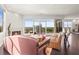 Bright living room with a fireplace, stylish furniture, and floor-to-ceiling windows showcasing the city view at 2881 Peachtree Ne Rd # 2304, Atlanta, GA 30305